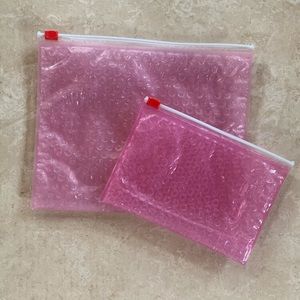 Glossier pink bubble makeup jewelry pouches